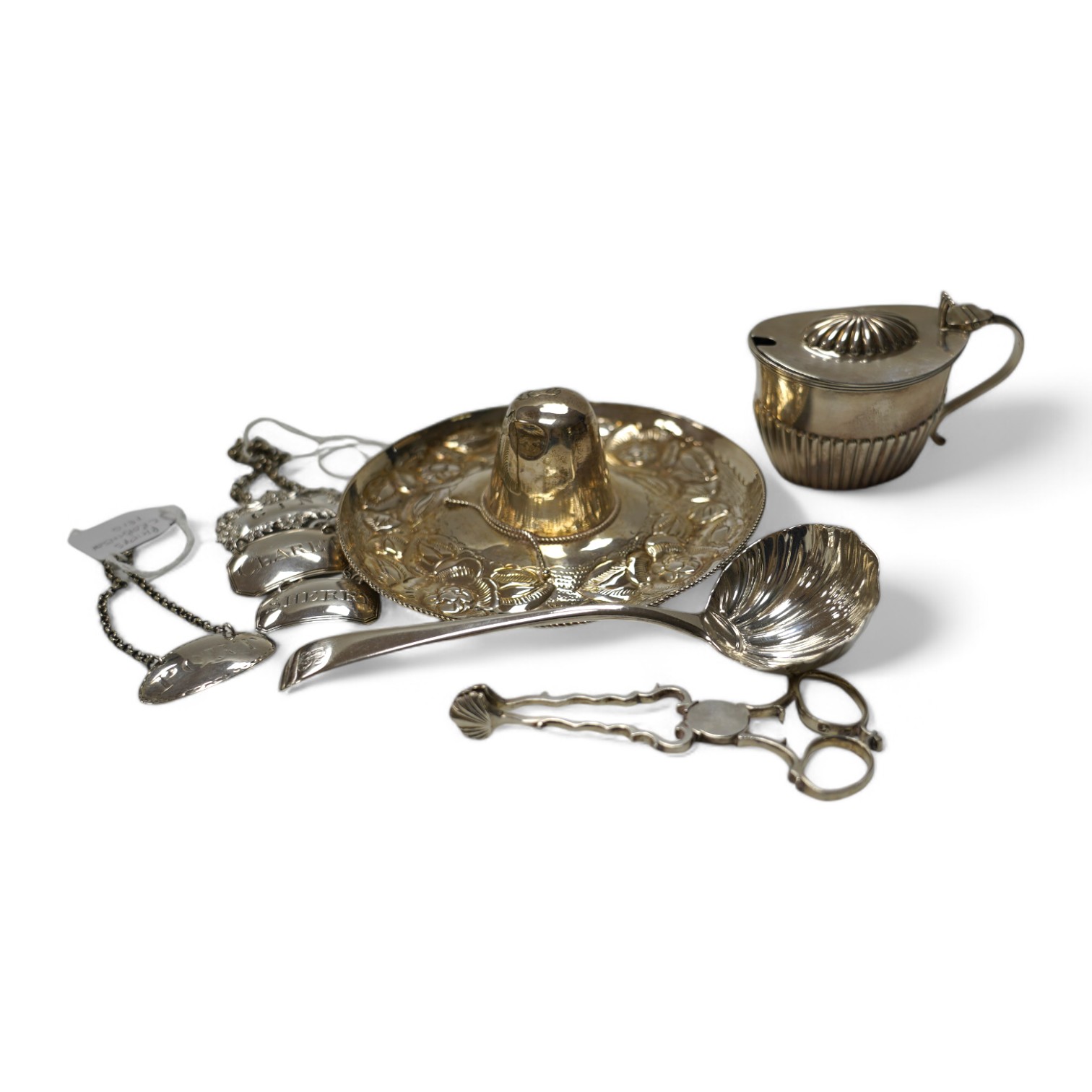 Four assorted 19th century silver wine labels, including a pair 'Sherry & Claret' by Joseph Wilmore, Birmingham, 1810, a Mexican 925 hat, a George III sauce ladle, by Eley & Fearn, London, 1802, a pair of silver sugar ni